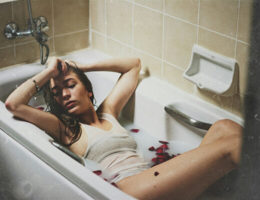 woman lying on bathtub