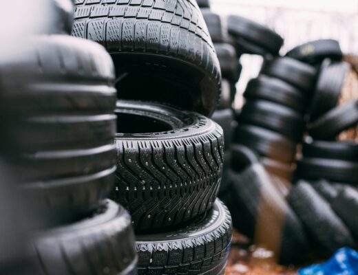 piles of car tires - Buying Used Tires in the USA? These Apps Can Help