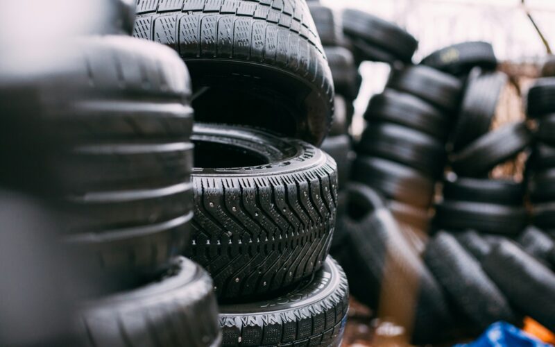 piles of car tires - Buying Used Tires in the USA? These Apps Can Help
